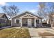 Charming home with a well-maintained front yard, a cozy porch, and classic curb appeal at 3251 N Madison St, Denver, CO 80205