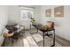 Bright office featuring a gray chair, a brown chair, a modern desk and a patterned rug at 3251 N Madison St, Denver, CO 80205