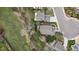Overhead aerial shot featuring houses, mature trees, and backyard outdoor living spaces at 10624 W Berry Pl, Littleton, CO 80127