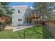 Charming backyard featuring a balcony, patio, artificial grass, and space for outdoor dining at 10624 W Berry Pl, Littleton, CO 80127