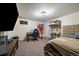 Bedroom space with an office desk, gaming chair, fish tank and comfortable bed at 10624 W Berry Pl, Littleton, CO 80127
