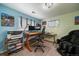 Office space featuring natural light, dual monitors, comfortable seating, and ample work area at 10624 W Berry Pl, Littleton, CO 80127