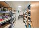 Basement storage room with rows of metal shelving, offering ample storage solutions at 5485 S Lakeview St, Littleton, CO 80120