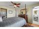 Bedroom features a four-poster bed and ensuite bathroom access at 5485 S Lakeview St, Littleton, CO 80120
