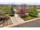 Charming home with a well-maintained front yard and mature trees at 5485 S Lakeview St, Littleton, CO 80120