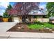 Inviting single-Gathering home with lovely curb appeal, showcasing a lush lawn and a well-maintained front yard at 5485 S Lakeview St, Littleton, CO 80120