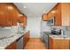 Charming kitchen features granite countertops, stainless steel appliances, and updated cabinets at 5485 S Lakeview St, Littleton, CO 80120