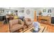 Open living space featuring hardwood floors, stylish decor, and seamless flow to other rooms at 5485 S Lakeview St, Littleton, CO 80120