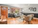 Inviting living room with hardwood floors, ample natural light, and comfortable seating arrangement at 5485 S Lakeview St, Littleton, CO 80120