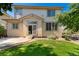 A well-maintained backyard with lush lawn, patio, and access to the home, framed by mature trees and landscaping at 13794 E Caley Dr, Englewood, CO 80111