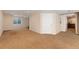 Open basement with large carpeted area and window at 13794 E Caley Dr, Englewood, CO 80111