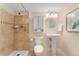 Bathroom featuring stone tiled shower and pedestal sink at 13794 E Caley Dr, Englewood, CO 80111