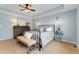 Comfortable bedroom with neutral walls, dark furniture, and bright natural light, creating a relaxing and inviting atmosphere at 13794 E Caley Dr, Englewood, CO 80111