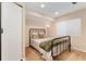 Small bedroom with carpet and metal bed frame at 13794 E Caley Dr, Englewood, CO 80111