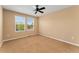Bright bedroom with carpet, two windows, a ceiling fan and neutral colored walls at 13794 E Caley Dr, Englewood, CO 80111