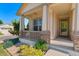 Charming front porch with stone accents, a cozy swing, and beautiful landscaping enhancing curb appeal at 13794 E Caley Dr, Englewood, CO 80111