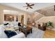 Spacious living room features hardwood floors, an archway to the kitchen, and stairway to upper level at 13794 E Caley Dr, Englewood, CO 80111