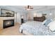 Spacious main bedroom with a fireplace, TV, and ensuite bathroom access, designed for ultimate relaxation and convenience at 13794 E Caley Dr, Englewood, CO 80111