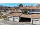 Aerial view of townhome community garages and carports with neighborhood views and mature trees at 1180 S Troy St, Aurora, CO 80012