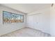 Comfortable bedroom featuring a large window and spacious closet at 1180 S Troy St, Aurora, CO 80012