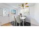 Bright dining area with modern furnishings, a stylish ceiling fan, and plenty of natural light at 1180 S Troy St, Aurora, CO 80012