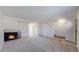 Open living room featuring a fireplace, neutral-toned furniture, and seamless flow for entertaining at 1180 S Troy St, Aurora, CO 80012