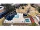 Aerial view of community pools and recreation areas with mature landscaping, plus a playground at 1180 S Troy St, Aurora, CO 80012