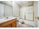 Bathroom featuring a vanity, toilet and shower with glass doors at 9630 W La Salle Ave, Lakewood, CO 80227