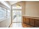 Bright dining area featuring wood floors, a sliding door, and storage at 9630 W La Salle Ave, Lakewood, CO 80227