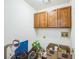 This laundry room includes storage cabinets and utility hookups at 9630 W La Salle Ave, Lakewood, CO 80227