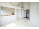 Open living room with an attached bathroom and stairway at 9630 W La Salle Ave, Lakewood, CO 80227
