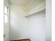 Walk-in closet that features shelving and rod with window that brings in lots of natural light at 9630 W La Salle Ave, Lakewood, CO 80227