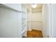 A walk-in closet features built-in shelving and hanging rods for optimal storage at 9630 W La Salle Ave, Lakewood, CO 80227