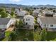 Charming two-story home featuring a private backyard, wood deck, lush landscaping, and partial fencing at 7720 Brown Bear Way, Littleton, CO 80125