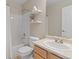 Bathroom with a shower-tub combination, a white vanity and shelving unit at 7720 Brown Bear Way, Littleton, CO 80125