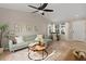 Bright living room featuring a comfortable couch, large windows, and modern decor for a welcoming atmosphere at 7720 Brown Bear Way, Littleton, CO 80125
