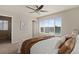 Spacious primary bedroom with a large window and ensuite bathroom at 7720 Brown Bear Way, Littleton, CO 80125