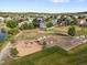 Community park featuring a large playground, sandy play area, and walking path at 7720 Brown Bear Way, Littleton, CO 80125