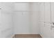 Walk-in closet featuring carpeted floors and adjustable wire shelving at 7720 Brown Bear Way, Littleton, CO 80125