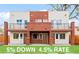 New construction duplex with modern design featuring brick accents, balconies, and welcoming front entrances at 1052 N Knox Ct, Denver, CO 80204