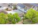 Aerial view of the home showcasing updated solar panels and proximity to lush trees at 3045 Arapahoe St, Denver, CO 80205