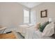 Comfortable bedroom with hardwood floors, decorated with neutral tones and soft throw pillows at 3045 Arapahoe St, Denver, CO 80205