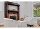 Inviting living room with a decorative fireplace, comfortable seating, and natural light from the window at 3045 Arapahoe St, Denver, CO 80205