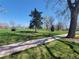 Picturesque park with walking paths, mature trees, and lush green spaces under a clear blue sky at 3045 Arapahoe St, Denver, CO 80205
