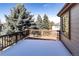 Spacious wood deck surrounded by mature trees at 8316 Green Island Cir, Lone Tree, CO 80124