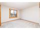 Sunny bedroom with plush carpet and a bright window at 8316 Green Island Cir, Lone Tree, CO 80124