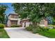 Traditional two-story house featuring a three-car garage and manicured landscaping at 8316 Green Island Cir, Lone Tree, CO 80124