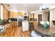 Stylish kitchen with stainless steel appliances, wood cabinets, and a breakfast nook at 8316 Green Island Cir, Lone Tree, CO 80124