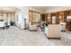 Cozy living room with built-in bookshelves, large window, and elegant furniture at 8316 Green Island Cir, Lone Tree, CO 80124