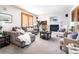 Bright living room features a fireplace, stylish furniture, and light-filled windows at 8316 Green Island Cir, Lone Tree, CO 80124